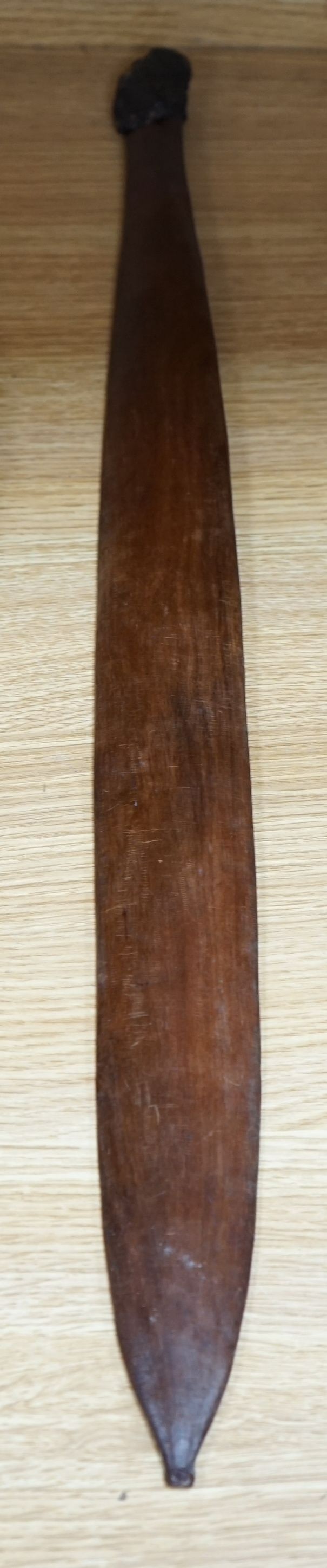 A carved wooden bladed war club, 71cms long